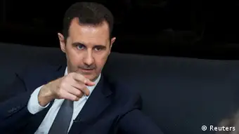 Syria's president Bashar al-Assad gestures during an interview with French daily Le Figaro in Damascus in this handout distributed by Syria's national news agency SANA on September 2, 2013. REUTERS/SANA/Handout (SYRIA - Tags: CONFLICT CIVIL UNREST POLITICS ) ATTENTION EDITORS - THIS IMAGE WAS PROVIDED BY A THIRD PARTY. FOR EDITORIAL USE ONLY. NOT FOR SALE FOR MARKETING OR ADVERTISING CAMPAIGNS. THIS PICTURE IS DISTRIBUTED EXACTLY AS RECEIVED BY REUTERS, AS A SERVICE TO CLIENTS