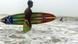 TO GO WITH AFP STORY "Lifestyle-Bangladesh-surfing,FEATURE" by Julie Clothier Bangladeshi surfer Jafar Alam prepares to surf in the waters of The Bay of Bengal at Cox's Bazar on June 30, 2008. With his fluorescent board shorts and muscular body, Jafar Alam does not look like a typical Bangladeshi. While most men his age in this conservative Muslim country are obsessed with cricket, the 25-year-old is more likely to be found surfing the waves on one of the world�s longest beaches. Alam, who says he is Bangladesh�s first surfer, is working to not only popularise the sport, but also to build international recognition for the largely untouched beach where he surfs. AFP PHOTO/Farjana Khan GODHULY (Photo credit should read Farjana KHAN GODHULY/AFP/Getty Images) TO GO WITH AFP STORY "Lifestyle-Bangladesh-surfing,FEATURE" by Julie Clothier Bangladeshi surfer Jafar Alam prepares to surf in the waters of The Bay of Bengal at Cox's Bazar on June 30, 2008. With his fluorescent board shorts and muscular body, Jafar Alam does not look like a typical Bangladeshi. While most men his age in this conservative Muslim country are obsessed with cricket, the 25-year-old is more likely to be found surfing the waves on one of the world�s longest beaches. Alam, who says he is Bangladesh�s first surfer, is working to not only popularise the sport, but also to build international recognition for the largely untouched beach where he surfs. AFP PHOTO/Farjana Khan GODHULY (Photo credit should read Farjana KHAN GODHULY/AFP/Getty Images)