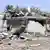 epa03862632 A man stands amid rubbles of a damaged building near the site of explosion that was targeting a military headquarters in Rafah, Egypt, 11 September 2013. According to media sources, six soldiers were killed and 17 people were injured, including seven civilians, in twin car bombings targeting the local intelligence offices and a nearby security checkpoint in Rafah town. The attack came a day after the army reportedly killed nine suspected insurgents as part of a major offensive against suspected Islamist insurgents that started in Sinai on 07 September. EPA/STR ALTERNATIVE CROP pixel