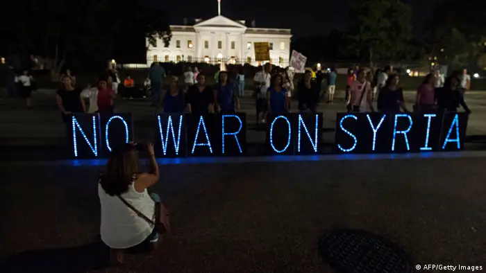 Anti-war demonstrators protest against US intervention in Syria in front of the White House in Washington on September 10, 2013 before US President Brack Obama addresses the nation on Syria. AFP PHOTO/Nicholas KAMM (Photo credit should read NICHOLAS KAMM/AFP/Getty Images)