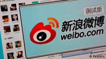 The logo of Sina Corp's Chinese microblog website Weibo is seen on a screen in this photo illustration taken in Beijing in this September 13, 2011 file photo. Sina Corp, one of China's biggest Internet firms, runs the microblogging site, which has 500 million registered users. It also employs the censors. The Sina Weibo censors are a small part of the tens of thousands of censors employed in China to control content in traditional media and on the Internet. Picture taken September 13, 2011. REUTERS/Stringer/Files (CHINA - Tags: POLITICS SCIENCE TECHNOLOGY BUSINESS TELECOMS)