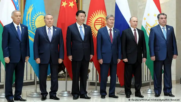 (R-L) Tajikistan's President Emomali Rakhmon, Russia's President Vladimir Putin, Kyrgyzstan's President Almazbek Atambayev, China's President Xi Jinping, Kazakhstan's President Nursultan Nazarbayev and Uzbekistan's President Islam Karimov pose for a picture before a session of Shanghai Cooperation Organization (SCO) summit in Bishkek, September 13, 2013. REUTERS/Mikhail Klimentyev/RIA Novosti/Kremlin (KYRGYZSTAN - Tags: POLITICS BUSINESS) ATTENTION EDITORS - THIS IMAGE HAS BEEN SUPPLIED BY A THIRD PARTY. IT IS DISTRIBUTED, EXACTLY AS RECEIVED BY REUTERS, AS A SERVICE TO CLIENTS