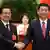 Hu Jintao and Xi Jinping (r.)