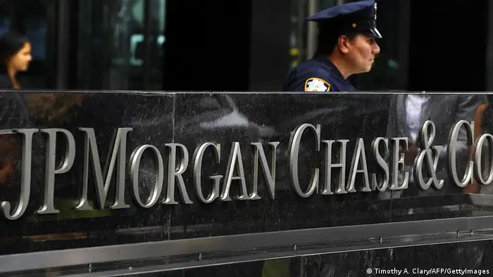 A New York City Police office at the entrance to the JP Morgan Chase World Headquarters on Park Avenue July 13, 2012 in New York. JPMorgan's losses from botched derivatives trades hit 4.4 billion USD in the second quarter, double the amount first thought, an earnings report revealed on July 13. AFP PHOTO/TIMOTHY A. CLARY (Photo credit should read TIMOTHY A. CLARY/AFP/GettyImages)