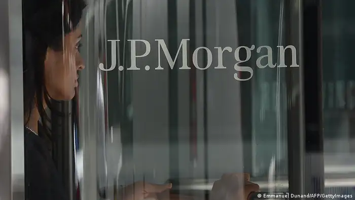 A woman leaves JP Morgan Chase & Company headquarters in New York, August 14, 2013. The US August 14, 2013 charged a pair of former JPMorgan Chase traders with fraud in connection with the 2012 $6.2 billion 'London whale' trading losses. Federal prosecutors filed criminal charges against Javier Martin-Artajo and Julien Grout, alleging the two men kept false records on the trades, committed wire fraud and submitted false US securities filings. AFP PHOTO/Emmanuel Dunand (Photo credit should read EMMANUEL DUNAND/AFP/Getty Images)