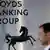 Man walking past window of Lloyds Banking Group