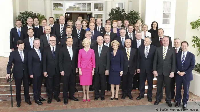 CANBERRA, AUSTRALIA - SEPTEMBER 18: Prime Minister Tony Abbott and his team pose for photographers with the Governor-General Quentin Bryce at Government House on September 18, 2013 in Canberra, Australia. Tony Abbott was today sworn is as the 28th Prime Minister of Australia, with his parliamentary secretaries and ministers also being confirmed by the Governor-General. Abbott has proclaimed today will be a day of action and plans to start the process to repeal the carbon tax and reduce the number of asylum seeker arrivals. (Photo by Stefan Postles/Getty Images)