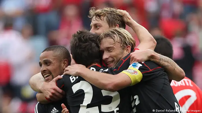 Australian forward Robbie Kruse (No.23) is mobbed by his Leverkusen team-mates after scoring his second goal - and his side's third - in Saturday's 4-1 win over Mainz. It was Kruse's first start for his new club, having joined from Fortuna Düsseldorf during the off-season. Photo: dpa