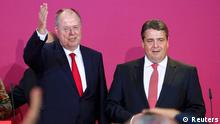 Peer Steinbrueck (L), top candidate of the Social Democratic Party (SPD) and party leader Sigmar Gabriel address supporters after first exit polls in the German general election (Bundestagswahl) at the party headquarters in Berlin September 22, 2013. REUTERS/Thomas Peter (GERMANY - Tags: ELECTIONS POLITICS)