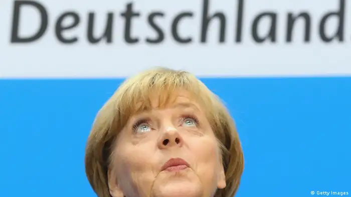 BERLIN, GERMANY - SEPTEMBER 23: Angela Merkel, German Chancellor and Chairwoman of the German Christian Democrats (CDU), looks on during a press conference after at a meeting of the CDU governing board on the first day after German federal elections at CDU headquarter Konrad-Adenauer-Haus on September 23, 2013 in Berlin, Germany. The CDU finished with approximately 42% of the vote, which puts the party just shy of a majority of seats in the Bundestag. The CDU will now face the task of finding a coalition partner, which is complicated by the failure of its current partner, the German Free Democrats (FDP), to stay above the 5% necessary to retain its Bundestag seats. (Photo by Alexander Hassenstein/Getty Images)