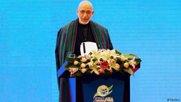 Afghanistan's President Hamid Karzai gives a speech at the 2013 Euro-Asia Economic Forum in Xi'an, Shaanxi province September 26, 2013. REUTERS/China Daily (CHINA - Tags: POLITICS BUSINESS) CHINA OUT. NO COMMERCIAL OR EDITORIAL SALES IN CHINA