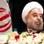Iranian President Hassan Rouhani takes his chair before a news conference at the Millennium Hotel in midtown Manhattan, Friday, Sept. 27, 2013, in New York. (AP Photo/John Minchillo