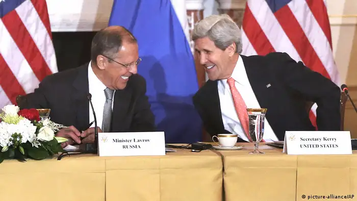 Secretary of State John Kerry smiles and talks with Russian Foreign Minister Sergei Lavrov after they made statements to reporters during their meeting at the State Department in Washington, Friday, Aug. 9, 2013. The crisis in Syria, arms control and missile defense headline what are expected to be chilly talks between top U.S. and Russian foreign and defense chiefs, a sit-down tainted by the case of National Security Agency leaker Edward Snowden, which led President Barack Obama to cancel his upcoming meeting with Russian President Vladimir Putin. (AP Photo/Charles Dharapak)