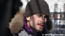 ITAR-TASS: MOSCOW, RUSSIA. MARCH 8, 2013. Pyotr Verzilov, member of Voina [War] art group and husband of Nadezhda Tolokonnikova, seen during a picket in support of the jailed members of the Pussy Riot punk band, at the Federal Penitentiary Service building in Kaluzhskaya Square. (Photo ITAR-TASS / Anton Novoderezhkin)