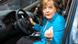 Merkel sitting in an Audi Merkel sitting in an Audi
