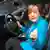 Angela Merkel at the wheel of a car