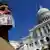 John Zangas, who identified himself as a federal employee, protests against the current government shutdown at the U.S. Capitol in Washington, October 2, 2013. REUTERS/Jonathan Ernst (UNITED STATES - Tags: POLITICS CIVIL UNREST BUSINESS EMPLOYMENT TPX IMAGES OF THE DAY)