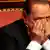 Italian center-right leader Silvio Berlusconi gestures during a confidence vote at the Senate in Rome, October 2, 2013. IBerlusconi on Wednesday backtracked from his attempts to bring down the government and told the Senate his People of Freedom party would support Prime Minister Enrico Letta in a confidence vote. Berlusconi said that having listened to Letta's speech promising tax cuts and economic and judicial reform, "we have decided, not without some internal strife, to support the government." REUTERS/Tony Gentile (ITALY - Tags: POLITICS)