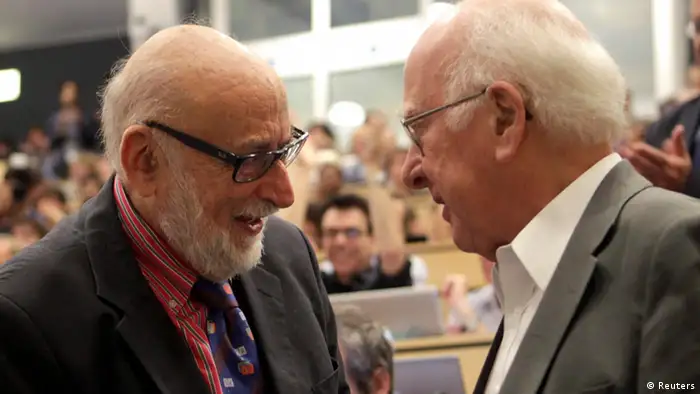 File picture of British physicist Peter Higgs (R) talking to Belgium physicist Francois Englert before a scientific seminar to deliver the latest update in the search for the Higgs boson at the European Organization for Nuclear Research (CERN) in Meyrin near Geneva July 4, 2012. Britain's Peter Higgs and Belgium's Francois Englert won the 2013 Nobel prize for physics for predicting the existence of the Higgs boson - the particle key to explaining why elementary matter has mass - the award-giving body said October 8, 2013. Picture taken July 4, 2012. REUTERS/Denis Balibouse/Files (SWITZERLAND - Tags: SCIENCE TECHNOLOGY)