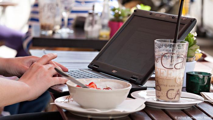 Breakfast in cafe with laptop