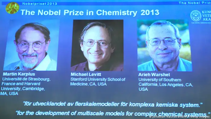 Portraits of scientists (L-R) Martin Karplus, Michael Levitt and Arieh Warshel are displayed on a screen during a press conference to announce the laureates of the 2013 Nobel Prize in Chemistry on October 9, 2013 at the Nobel Assembly at the Royal Swedish Academy of Sciences in Stockholm. US-Austrian Martin Karplus, US-British Michael Levitt and US-Israeli Arieh Warshel won Nobel Chemistry Prize for the development of multiscale models for complex chemical systems. AFP PHOTO / JONATHAN NACKSTRAND (Photo credit should read JONATHAN NACKSTRAND/AFP/Getty Images)