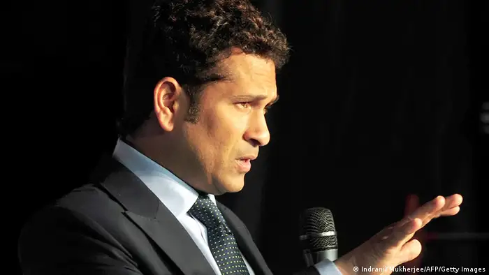 Indian cricketer Sachin Tendulkar gestures during an event to launch a specially designed 'cricket series television' which includes his input, in Mumbai on September 6, 2013. Dubbed the 'Little Master', Tendulkar has scored 15,837 runs in 198 Tests with 51 centuries and 18,426 runs in 463 one-day internationals with 49 hundreds. Tendulkar, who quit one-dayers in 2012, plays his 200th test match later in 2013 against the West Indies on his home soil. AFP PHOTO/Indranil MUKHERJEE (Photo credit should read INDRANIL MUKHERJEE/AFP/Getty Images)