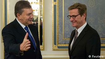 Ukrainian President Viktor Yanukovich speaking with German Foreign Minister Guido Westerwelle REUTERS/Gleb Garanich