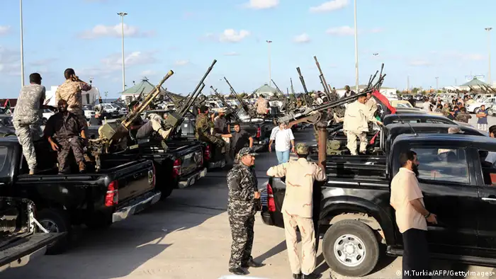 Libyan security gather in the capital Tripoli on September 21, 2013, as they prepare to secure neighborhoods and the headquarters of government departments following a decision by the National Congress to clamp down on crime and criminal groups around the capital. AFP PHOTO/MAHMUD TURKIA (Photo credit should read MAHMUD TURKIA/AFP/Getty Images)