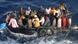 Migrants traveling on a rubber dinghy Migrants traveling on a rubber dinghy