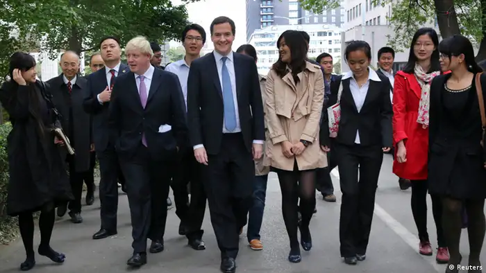 Britain's Chancellor of the Exchequer, George Osborne (C), and Mayor of London Boris Johnson (2nd L) walk the campus during their visit to Peking University in Beijing, October 14, 2013. REUTERS/China Daily (CHINA - Tags: POLITICS BUSINESS) CHINA OUT. NO COMMERCIAL OR EDITORIAL SALES IN CHINA