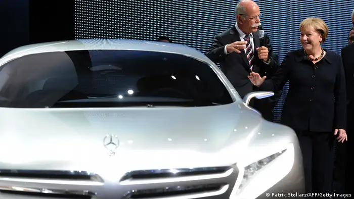 German Chancellor Angela Merkel and Dieter Zetsche, CEO of German car maker Daimler AG, stand next to a Mercedes F 125 Concept fuel cell hybrid car during Merkel's tour to open the international Frankfurt motor show IAA (Internationale Automobil-Ausstellung) in Frankfurt/M., western Germany, on September 15, 2011. The world's biggest motor show, the IAA, is running from September 15 to 25, 2011. AFP PHOTO PATRIK STOLLARZ (Photo credit should read PATRIK STOLLARZ/AFP/Getty Images)