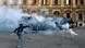 A demonstrator throws a bottle at Guardia di Finanza during a protest in downtown Rome (Photo: REUTERS/ Alessandro Bianchi) A demonstrator throws a bottle at Guardia di Finanza during a protest in downtown Rome (Photo: REUTERS/ Alessandro Bianchi)