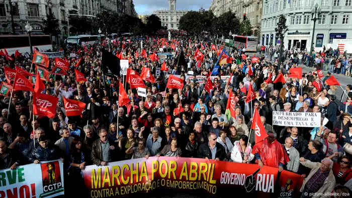 epa03916224 Trade union CGTP-IN supporters protest in Porto, Portugal, 19 October 2013, in protest against the austerity measures planned by the Portuguese government for next year. EPA/FERNANDO VELUDO