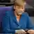Bundeskanzlerin Angela Merkel (CDU) hält am 03.09.2013 in Berlin in der Sitzung des Bundestages ihr Mobiltelefon in den Händen. Weniger als drei Wochen vor der Wahl ist der Bundestag zu seiner voraussichtlich letzten Sitzung zusammengekommen. Foto: Soeren Stache/dpa
