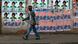 A man walks past campaign posters outside a polling centre in the capital Antananarivo, October 25, 2013. The people of Madagascar began voting on Friday in a presidential election they hope will end a five-year crisis and rebuild investor confidence to mend an economy crippled since President Andry Rajoelina seized power in a 2009 coup. REUTERS/Thomas Mukoya (MADAGASCAR - Tags: POLITICS ELECTIONS) A man walks past campaign posters outside a polling centre in the capital Antananarivo, October 25, 2013. The people of Madagascar began voting on Friday in a presidential election they hope will end a five-year crisis and rebuild investor confidence to mend an economy crippled since President Andry Rajoelina seized power in a 2009 coup. REUTERS/Thomas Mukoya (MADAGASCAR - Tags: POLITICS ELECTIONS)