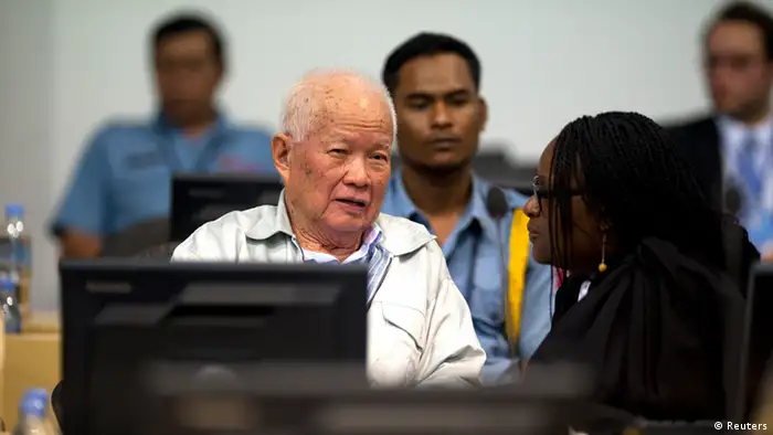 Khmer Rouge former president Khieu Samphan (front L) is seen at the Extraordinary Chambers in the Courts of Cambodia (ECCC), on the outskirts of Phnom Penh in this handout picture dated October 31, 2013. The Khmer Rouge war crimes tribunal is hearing closing arguments in the court's biggest case - known as Case 002 - after lengthy hearings into one of the darkest chapters of the 20th century. Between 1.7 and 2.2 million people died between 1975 and 1979 under the ultra-Maoist Khmer Rouge regime. The case's remaining defendants in the court - ''Brother Number Two'' Nuon Chea and ex-president Khieu Samphan - will make their presentations in response to criminal charges - crimes against humanity in relation to the alleged forced evacuation of population out of cities and the alleged execution of former government soldiers when they took over in 1975. REUTERS/Mark Peterson/ECCC/Handout via Reuters (CAMBODIA - Tags: POLITICS CONFLICT CRIME LAW) ATTENTION EDITORS - THIS IMAGE WAS PROVIDED BY A THIRD PARTY. FOR EDITORIAL USE ONLY. NOT FOR SALE FOR MARKETING OR ADVERTISING CAMPAIGNS. THIS PICTURE IS DISTRIBUTED EXACTLY AS RECEIVED BY REUTERS, AS A SERVICE TO CLIENTS. NO SALES. NO ARCHIVES
