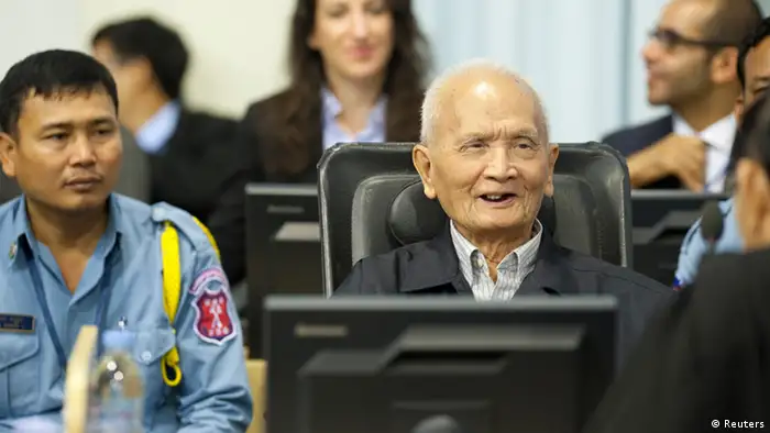 Former Khmer Rouge leader ''Brother Number Two'' Nuon Chea (C), is seen at the Extraordinary Chambers in the Courts of Cambodia (ECCC), in the outskirts of Phnom Penh in this handout picture dated October 31, 2013. Khmer Rouge war crimes tribunal is hearing closing arguments in the court's biggest case - known as Case 002 - after lengthy hearings into one of the darkest chapters of the 20th century. Between 1.7 and 2.2 million people died between 1975 and 1979 under the ultra-Maoist Khmer Rouge regime. The case's remaining defendants in the court - ''Brother Number Two'' Nuon Chea and ex-president Khieu Samphan - will make their presentations in response to criminal charges - crimes against humanity in relation to the alleged forced evacuation of population out of cities and the alleged execution of former government soldiers when they took over in 1975. REUTERS/Mark Peters/ECCC/Handout via Reuters (CAMBODIA - Tags: POLITICS CONFLICT CRIME LAW) ATTENTION EDITORS - NO SALES. NO ARCHIVES. FOR EDITORIAL USE ONLY. NOT FOR SALE FOR MARKETING OR ADVERTISING CAMPAIGNS. THIS IMAGE HAS BEEN SUPPLIED BY A THIRD PARTY. IT IS DISTRIBUTED, EXACTLY AS RECEIVED BY REUTERS, AS A SERVICE TO CLIENTS