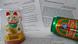 Text with a Chinese cat and can of Chinese beer Text with a Chinese cat and can of Chinese beer