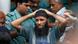 A prisoner reacts as police force him into a van after the verdict for a 2009 mutiny is announced, in Dhaka November 5, 2013. (Photo: Reuters) A prisoner reacts as police force him into a van after the verdict for a 2009 mutiny is announced, in Dhaka November 5, 2013. (Photo: Reuters)