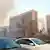 In this photo released by China's Xinhua News Agency, smoke billows from the site after explosions on the Yingze Street in Taiyuan, capital of north China' Shanxi Province, Wednesday, Nov. 6, 2013. One person was killed and several injured in a series of small explosions Wednesday outside the provincial headquarters of the ruling Communist Party in the northern Chinese city of Taiyuan, officials said. (AP Photo/Xinhua, Liu Guoliang) NO SALES