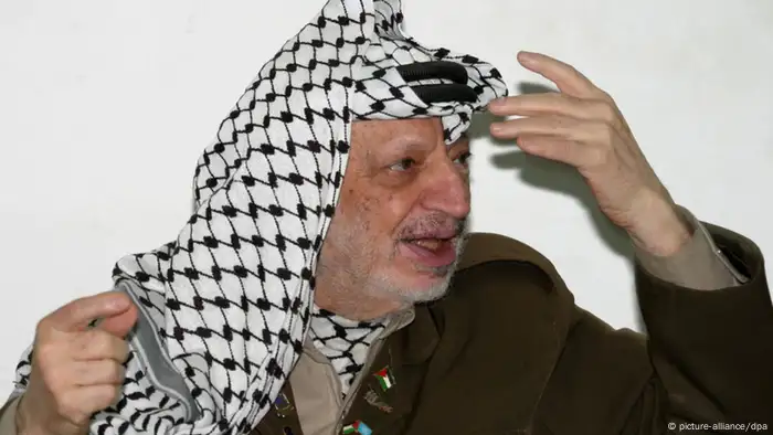 epa03910823 (FILE) A file photograph showing Palestinian leader Yasser Arafat gesturing during a meeting with Israeli peace activist Uri Avnery (not pictured) in Arafat's office in Ramallah Saturday 10 April 2004. Reports on 15 October 2013 state that a Russian official said that forensic tests found no indications of polonium poisoning in the body of the late Palestinian leader Yassir Arafat. Last week, Britain's The Lancet journal reported that Swiss scientists had concluded that Arafat had been poisoned with the radioactive element polonium 210. Arafat died at the age of 75 in a French hospital on November 11, 2004. Medical records show he died of a brain hemorrhage, caused by a bowel infection. EPA/ATEF SAFADI *** Local Caption *** 99490930