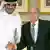 FIFA President Sepp Blatter (R) shakes hands with Qatar's 2022 World Cup Bid Chief Sheikh Mohammed Al-Thani (L) at a news conference in Doha November 9, 2013. Blatter confirmed that the 2022 World Cup will be moved to the end of the year. He also denied that Qatar will share hosting the World Cup with other countries in the region. REUTERS/Fadi Al-Assaad (QATAR - Tags: SPORT SOCCER WORLD CUP ROYALS)