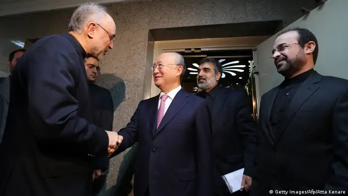 Head of Iran's Atomic Energy Organisation Ali Akbar Salehi (L) welcomes International Atomic Energy Agency (IAEA) Director General Yukiya Amano (C), prior to their meeting in Tehran on November 11, 2013. Amano arrived in the Iranian capital to discuss Iran's nuclear programme after top world diplomats fail to clinch a long-sought deal to curb Tehran's nuclear activities but insist they are narrowing the gaps. AFP PHOTO/ATTA KENARE (Photo credit should read ATTA KENARE/AFP/Getty Images)