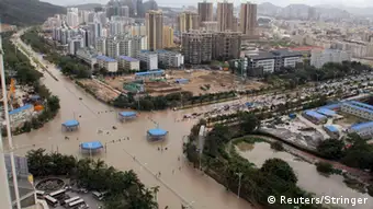 A view of flooded streets after rainstorms triggered by Typhoon Haiyan hit Sanya, Hainan province November 11, 2013. Rainstorms from the typhoon hit the south China region on Sunday and Monday, killing at least four, with seven people still missing, according to Xinhua News Agency. Haiyan, one of the most powerful storms ever recorded, killed an estimated 10,000 people in central Philippines, according to officials. Picture taken November 11, 2013. REUTERS/Stringer (CHINA - Tags: DISASTER ENVIRONMENT CITYSCAPE TPX IMAGES OF THE DAY) CHINA OUT. NO COMMERCIAL OR EDITORIAL SALES IN CHINA