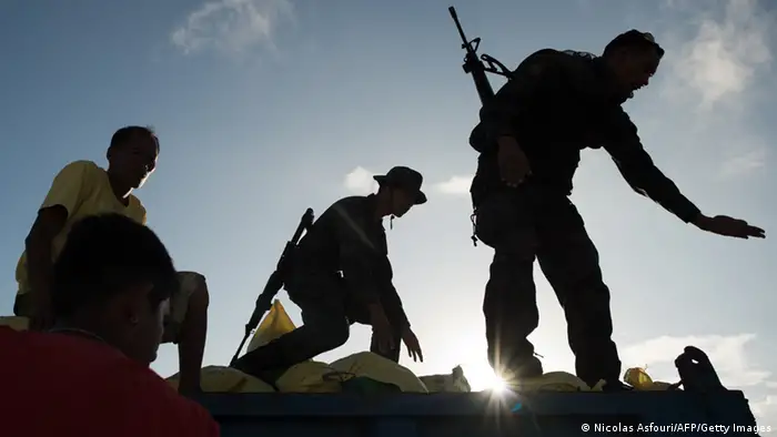 GettyImages 187922751 Philippines army soldiers and workers load an army truck with bags of rice to be distributed to typhoon survivors, at Tacloban airport on November 14, 2013. The United Nations estimates 10,000 people may have died in Tacloban alone, where five-metre (16-foot) waves flattened nearly everything in their path as they swept hundreds of metres across the low-lying land. AFP PHOTO / Nicolas ASFOURI (Photo credit should read NICOLAS ASFOURI/AFP/Getty Images)