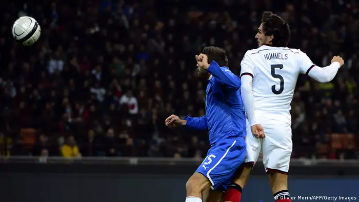 Germany's defender Mats Hummels (R) scores past Italy's defender Andrea Barzagli during the FIFA World Cup friendly football match Italy vs Germany on November 15, 2013 at the San Siro stadium in Milan. AFP PHOTO / OLIVIER MORIN (Photo credit should read OLIVIER MORIN/AFP/Getty Images)