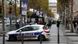 A police car patrols on the Champs-Elysees Avenue during a search operation over Paris, November 18, 2013. Police were hunting a lone gunman on the loose in central Paris on Monday after he opened fire at the offices of left-wing daily newspaper Liberation and a major bank before hijacking a car to take him to the Champs-Elysees avenue. The shaven-haired assailant, who police said was filmed by video-surveillance cameras, fired shots at the office of Liberation daily, seriously injuring a photographer's assistant before fleeing, police and staff at the newspaper said. Photo: Reuters A police car patrols on the Champs-Elysees Avenue during a search operation over Paris, November 18, 2013. Police were hunting a lone gunman on the loose in central Paris on Monday after he opened fire at the offices of left-wing daily newspaper Liberation and a major bank before hijacking a car to take him to the Champs-Elysees avenue. The shaven-haired assailant, who police said was filmed by video-surveillance cameras, fired shots at the office of Liberation daily, seriously injuring a photographer's assistant before fleeing, police and staff at the newspaper said. Photo: Reuters