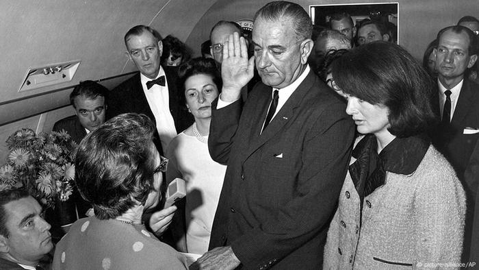 Lyndon B. Johnson being sworn in next to Jackie Kennedy