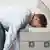 Man with his head on photocopier