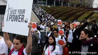 Members of NGOs walk out of United Nations Climate Change Conference COP 19 in Warsaw on November 21, 2013. They protested as they claim were 'on track to deliver virtually nothing' AFP PHOTO / JANEK SKARZYNSKI (Photo credit should read JANEK SKARZYNSKI/AFP/Getty Images)